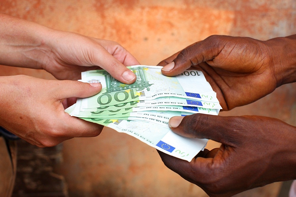 African holding Euros, Lome, Togo, West Africa, Africa