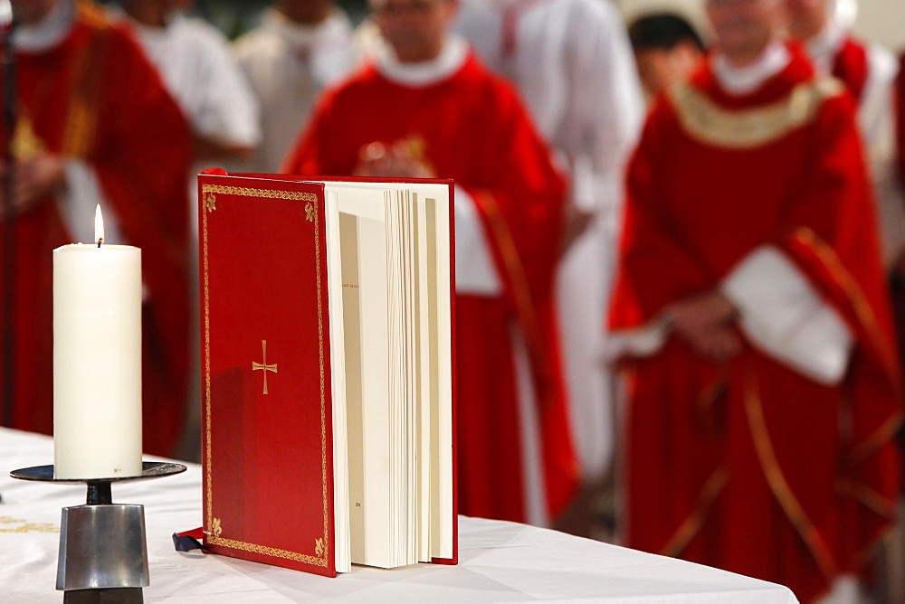 Candle and Gospel on altar, Seine-Saint-Denis, France, Europe