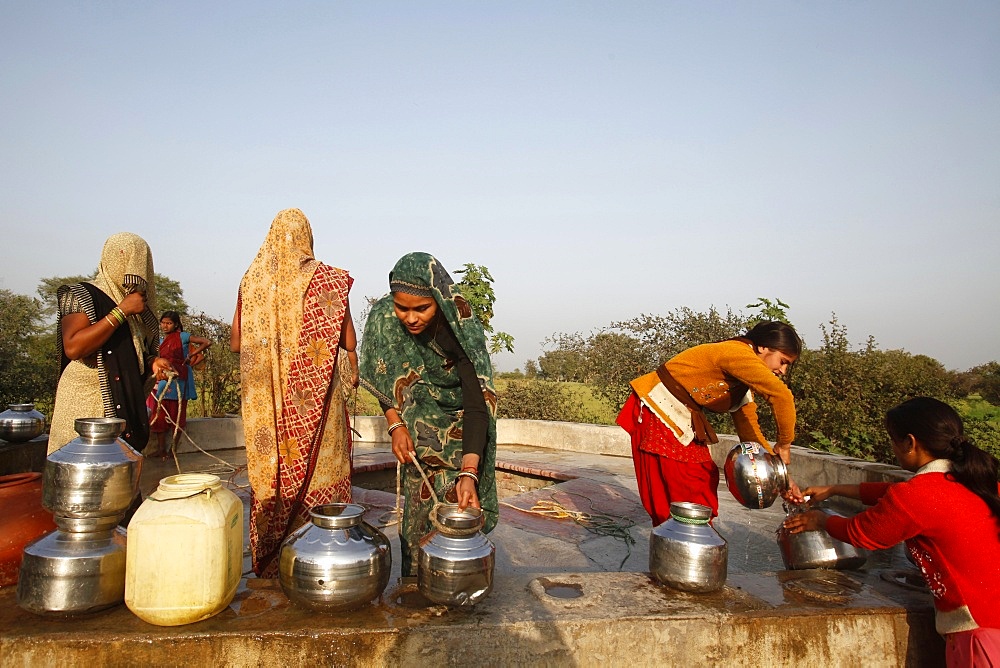 Women at a village well, Mathura, Uttar Pradesh, India, Asia