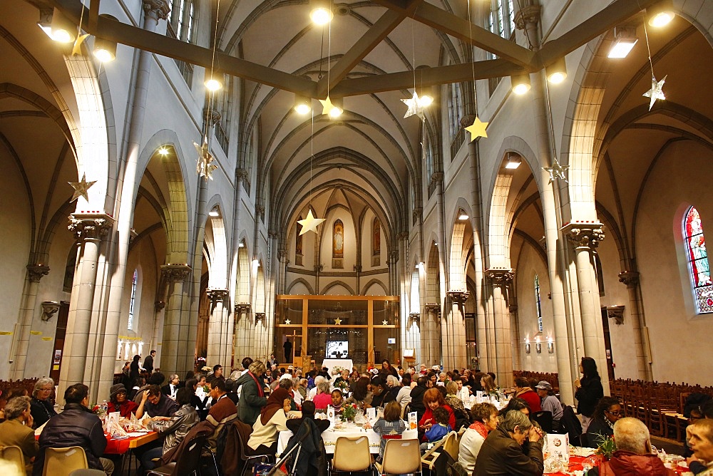 Christmas meal offered by the Sant'Egidio community in Saint-Hippolyte church, Paris