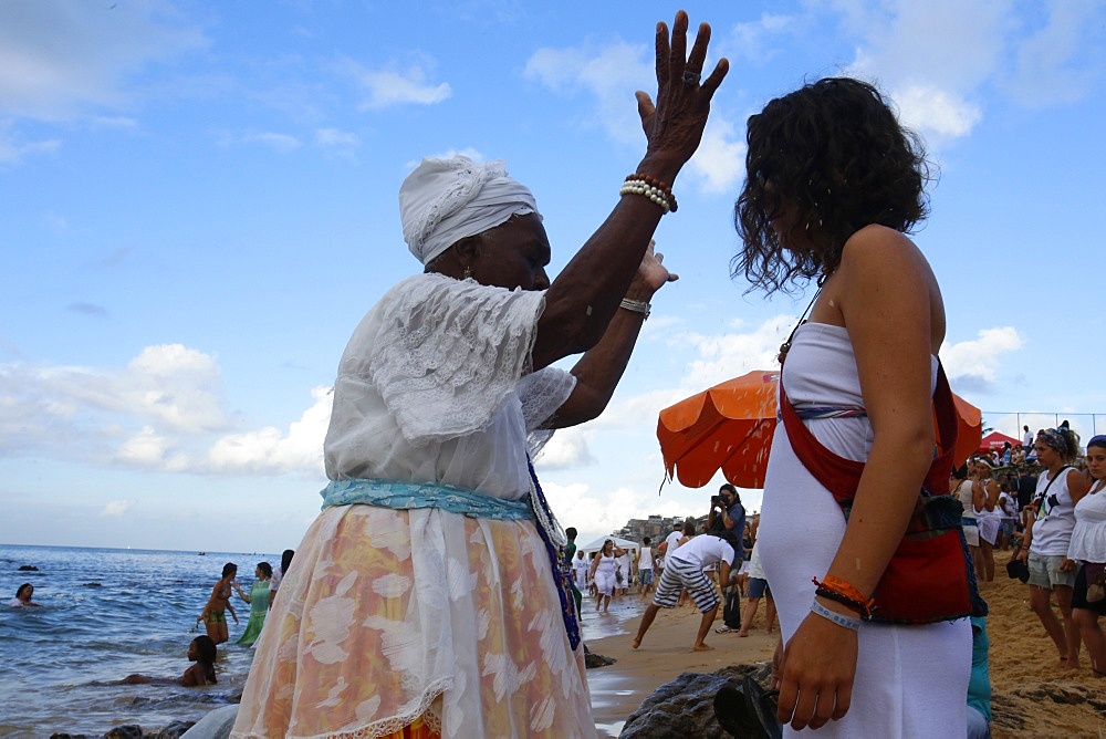 Candomble priestess performing a ritual during Lemanja festival in Rio Vermelho, Salvador, Bahia, Brazil, South America