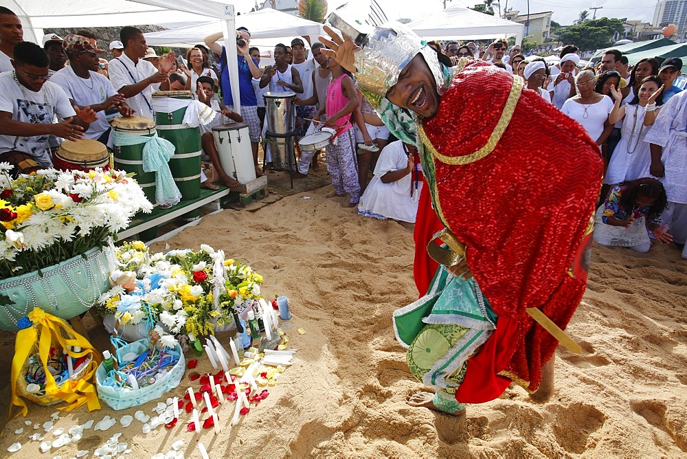 Entranced devotee embodying Orixa (Orisha) Oxosse during Lemnaja festival on Rio Vermelho beach, Salvador, Bahia, Brazil, South America