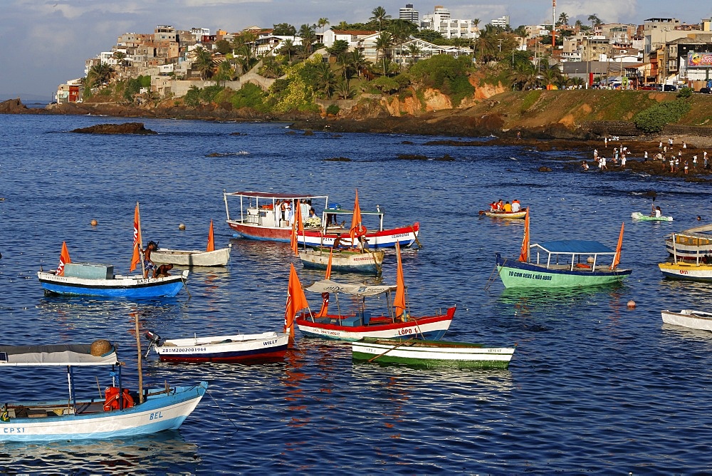 Fishing boats at sea during Lemanja festival on Rio Vermelho beach, Salvador, Bahia, Brazil, South America