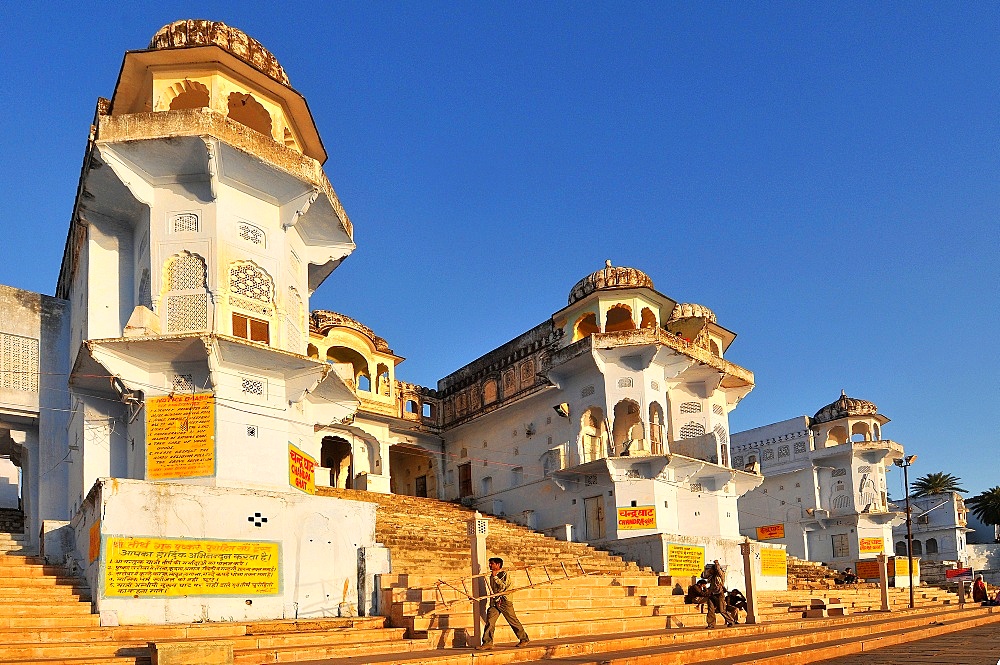 Ghats at Holy Pushkar Lake and old Rajput Palaces, Pushkar, Rajasthan, India, Asia