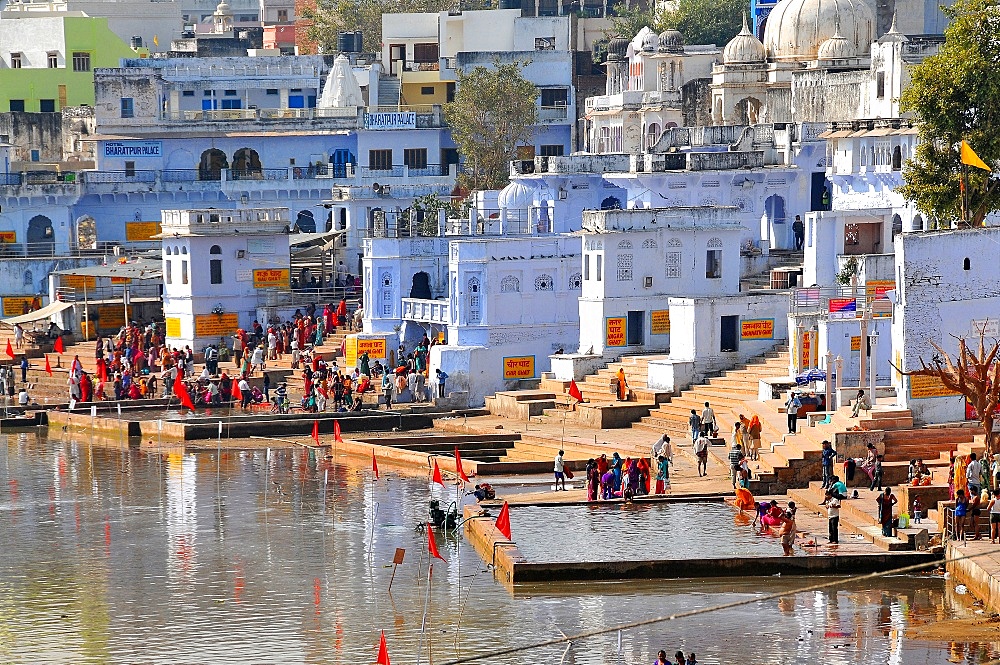 Ghats at Holy Pushkar Lake and old Rajput Palaces, Pushkar, Rajasthan, India, Asia