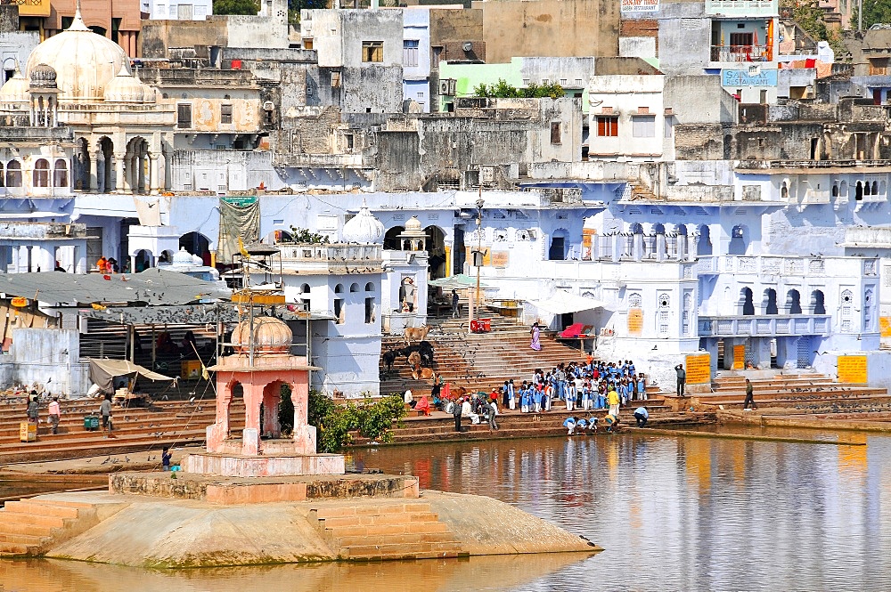 Ghats at Holy Pushkar Lake and old Rajput Palaces, Pushkar, Rajasthan, India, Asia