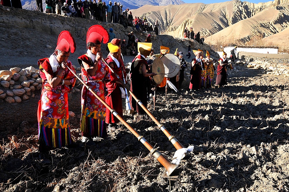 Ghami monastery monks blessing a field, Mustang, Nepal, Asia