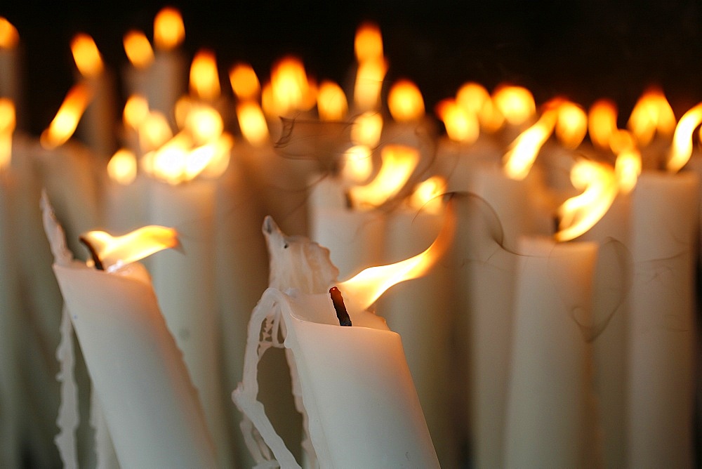 Candles at the Lourdes shrine, Lourdes, Hautes Pyrenees, France, Europe