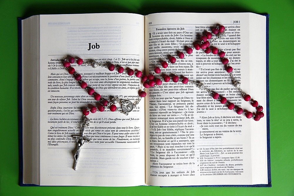 Prayer beads over an open Bible, Eure, France, Europe