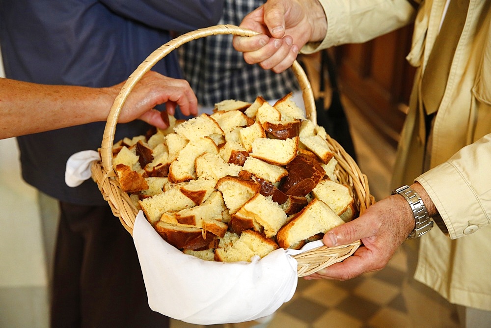 Distribution of blessed bread, St. Hubert's Mass, Notre Dame du Hamel, Eure, France, Europe