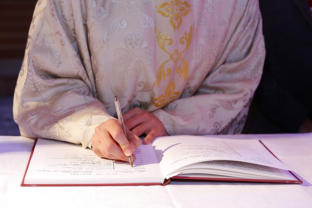 Signing the Baptism register, Mass of the sacraments at St. Joan of Arc's school in Montrouge, Hauts-de-Seine, France, Europe