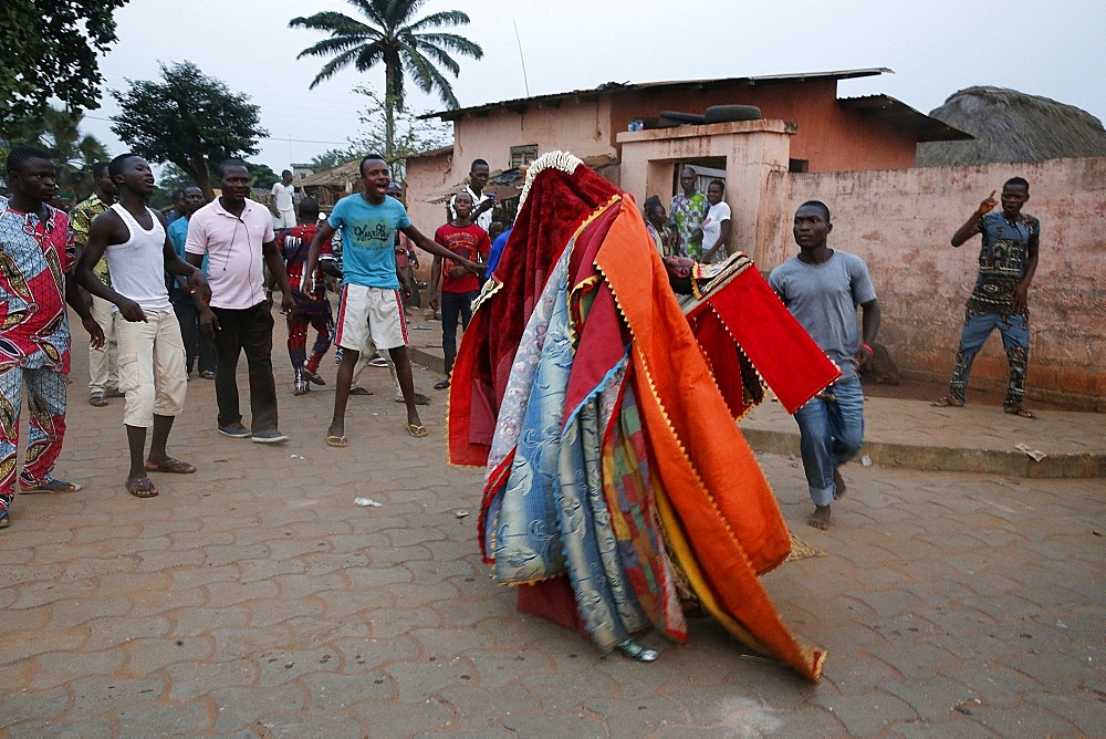 People keeping their distance as it's dangerous to touch the egoun-egoun, Feast of the Ghosts in Ouidah, Benin, West Africa, Africa