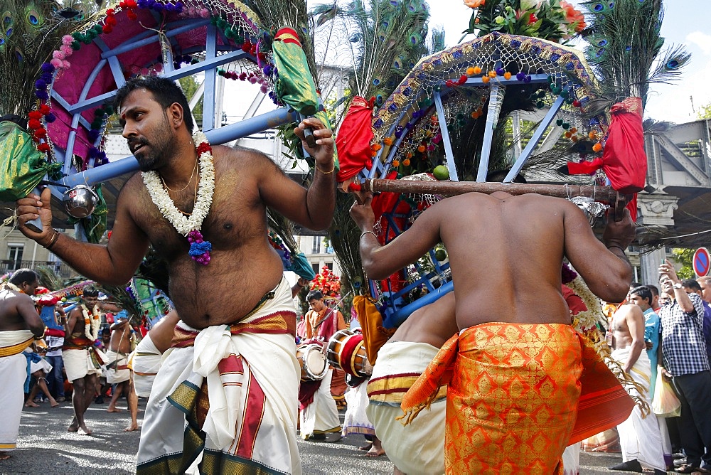 Men carrying kavadis and dancing, Ganesh Festival, Paris, France, Europe