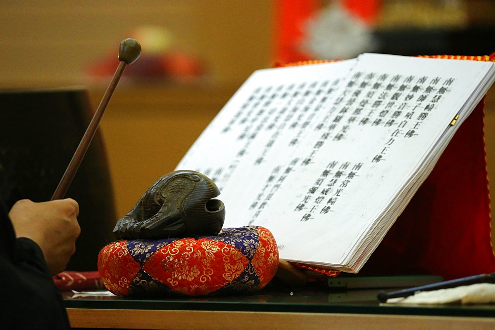 Buddhist sacred texts and a wooden fish (percussion instrument), Fo Guang Shan Temple, Geneva, Switzerland, Europe