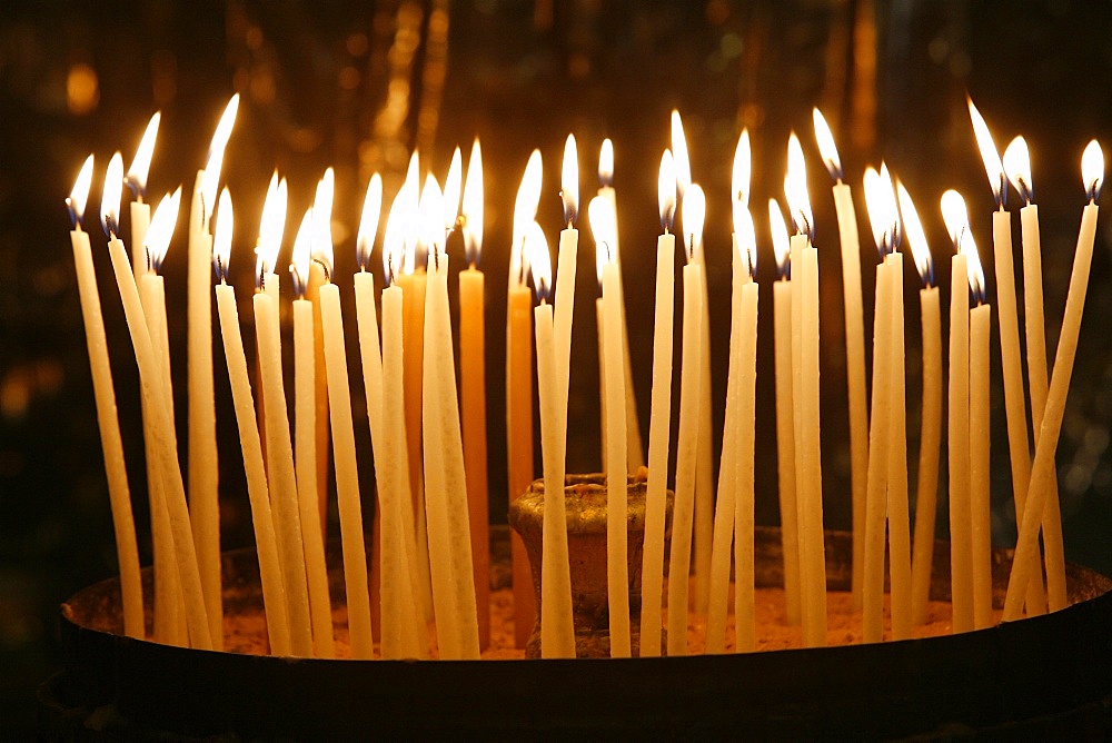 Candles in the Church of the Holy Sepulchre, Jerusalem, Israel, Middle East