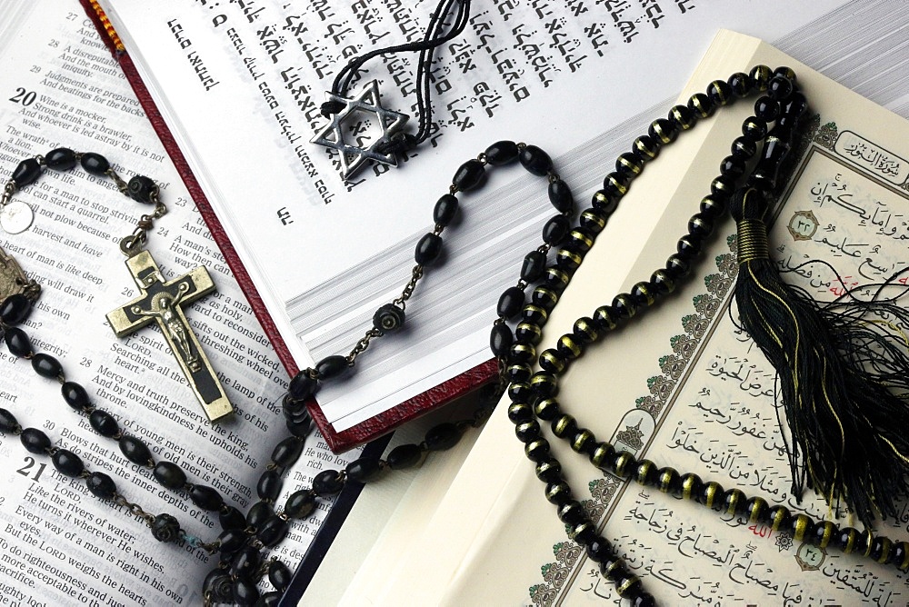 Bibles and Quran, interfaith symbols of Christianity, Islam and Judaism, the three monotheistic religions, Haute-Savoie, France, Europe