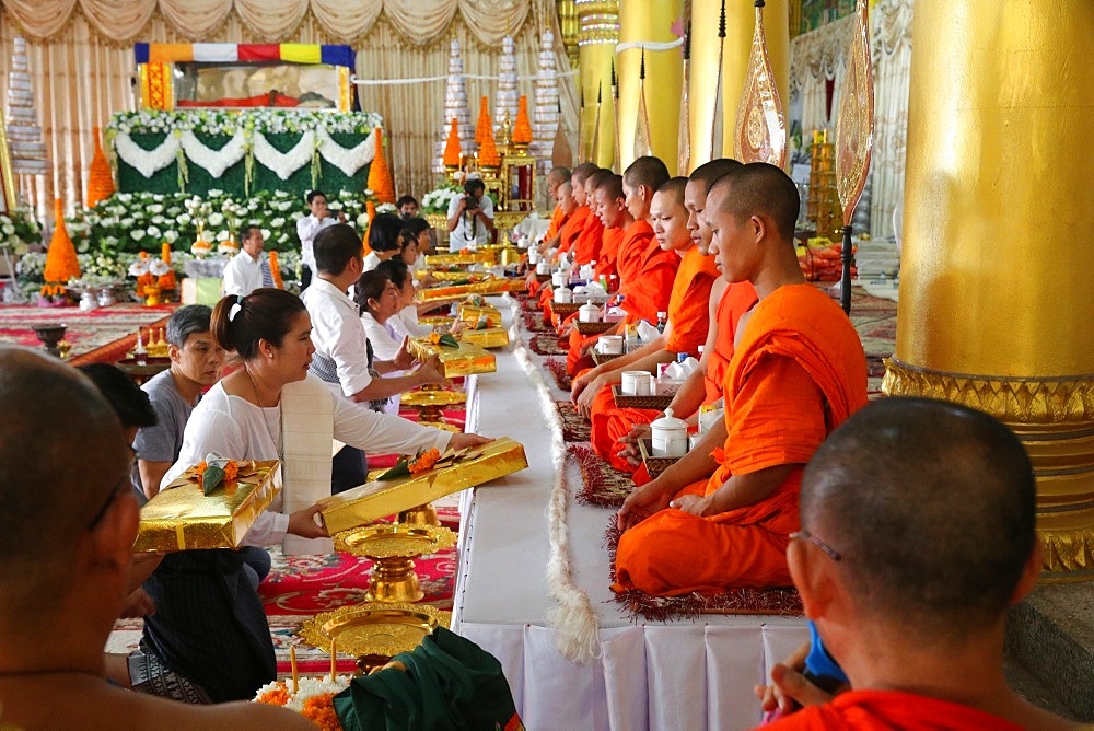 Seated Buddhist monks chanting and reading prayers at a ceremony, Wat Ong Teu Buddhist Temple, Vientiane, Laos, Indochina, Southeast Asia, Asia