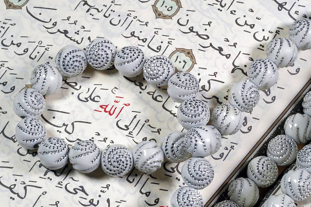 Quran and Tasbih (prayer beads), with Allah monogram in red, Haute-Savoie, France, Europe