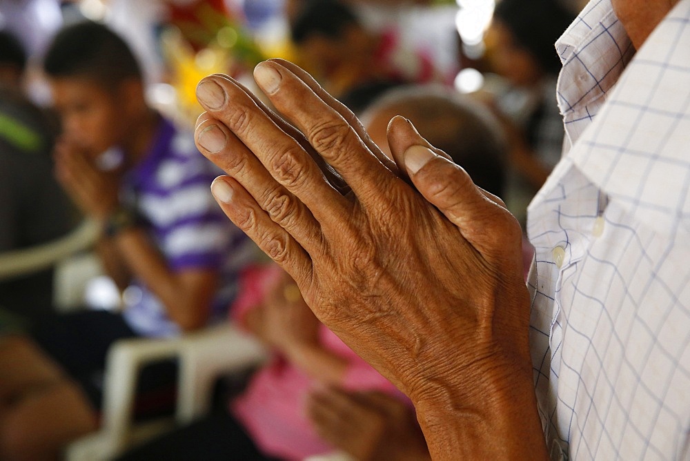 Hands in prayer, Khao Pansa celebration at Wat Ampharam, Hua Hin, Thailand, Southeast Asia, Asia