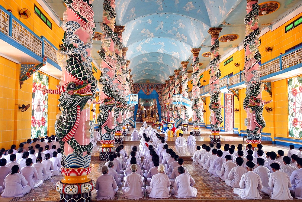 Praying devout men and women, ceremonial midday prayer, Cao Dai Holy See Temple, Tay Ninh, Vietnam, Indochina, Southeast Asia, Asia