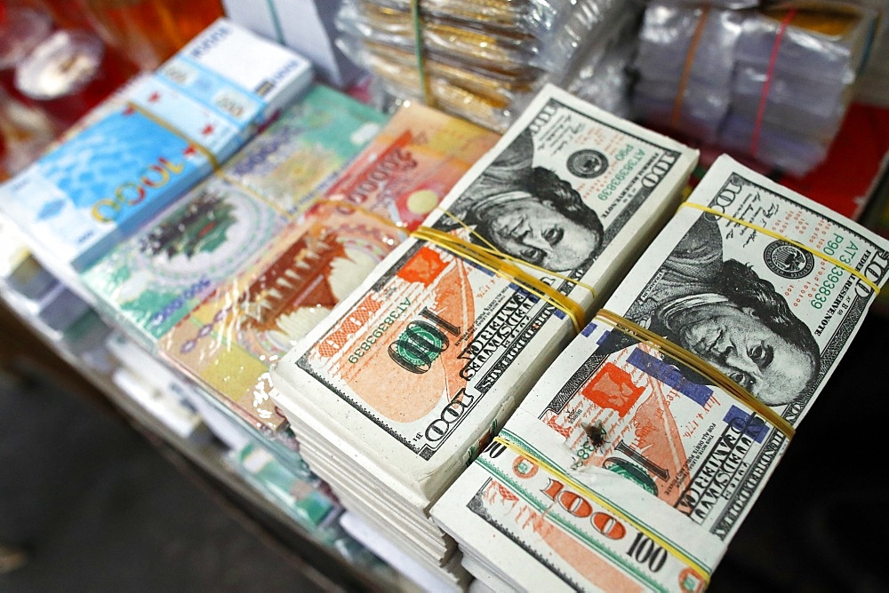 A shop selling Buddhist offerings for the temples, hell bank notes and other forms of joss paper, Ho Chi Minh City, Vietnam, Indochina, Southeast Asia, Asia