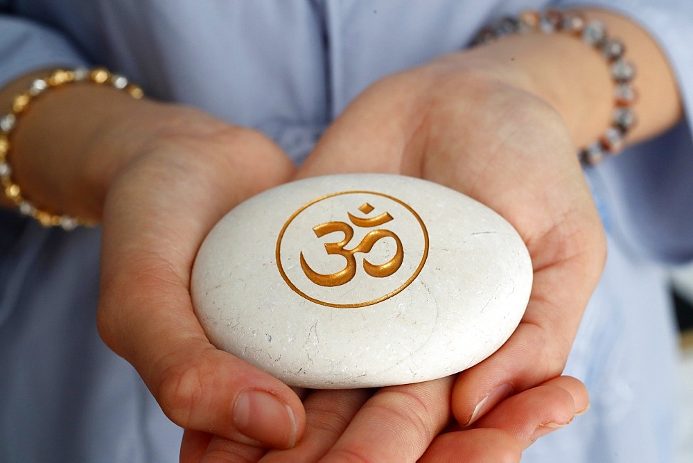 The Om (Aum) symbol of Hinduism and Buddhism on a white stone, Vietnam, Indochina, Southeast Asia, Asia