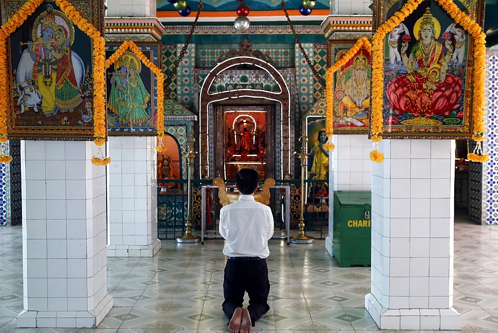 Worshipper praying, Sri Thenday Yutthapani Temple, Ho Chi Minh City, Vietnam, Indochina, Southeast Asia, Asia