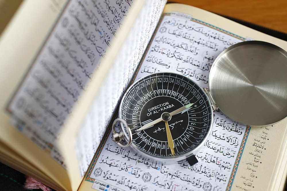 Quran and a Qibla compass to indicate the direction of Mecca, Vietnam, Indochina, Southeast Asia, Asia