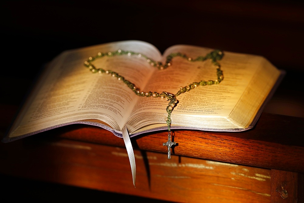 Open Bible and rosary in a church, Haute-Savoie, France, Europe