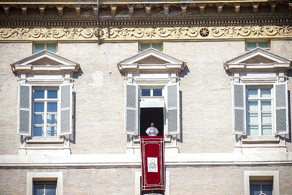 Pope Francis delivers his blessing during the Angelus noon prayer in St. Peter's Square, Vatican City, Rome, Lazio, Italy, Europe