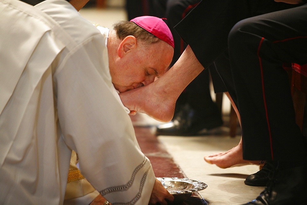 Bishop kissing feet after washing them, Easter Thursday Mass in St. Peter's Basilica, Vatican, Rome, Lazio, Italy, Europe