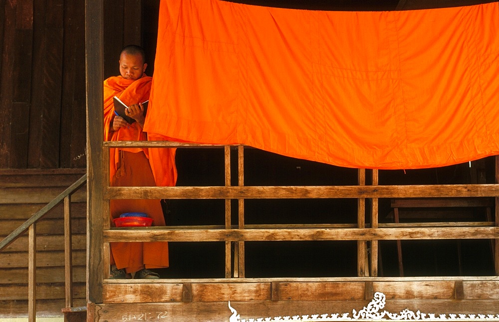 Monk reading, Vientiane, Laos, Indochina, Southeast Asia, Asia