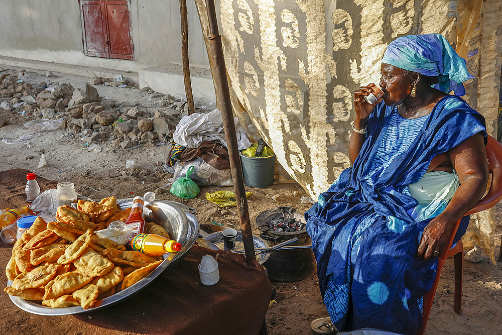 Snack vendor drinking coffee in Niakhar, Senegal, West Africa, Africa