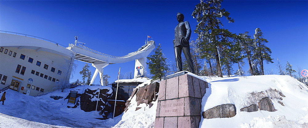 Statue of Fridtjof Nansen and the ski jump at the Ski Museum, Holmenkollen, near Oslo, Norway, Scandinavia, Europe