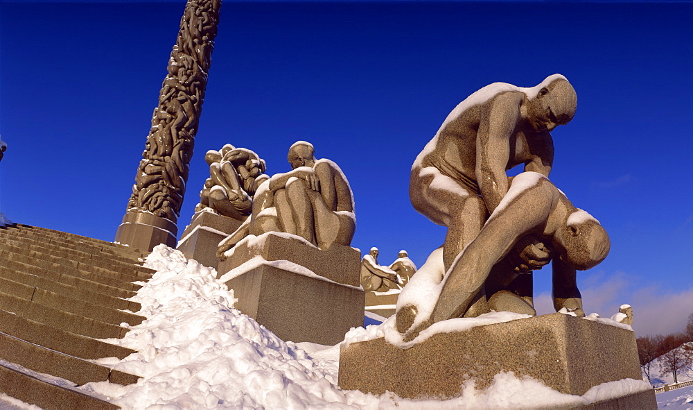 Snow covered statue in winter, Frogner Park (Vigeland's Park), Oslo, Norway, Scandinavia, Europe