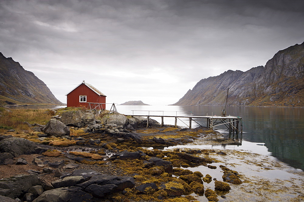 Rorbu (fisherman's hut) and jetty on fjord, Lofoten Islands, Norway, Scandinavia, Europe