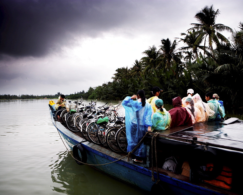 People and bikes on ferry, Hoi An, Vietnam, indochina, Southeast Asia, Asia