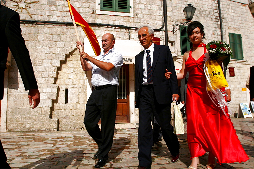 A wedding in the city of Kotor, the red is the color of the new independent state, Montenegro, Europe