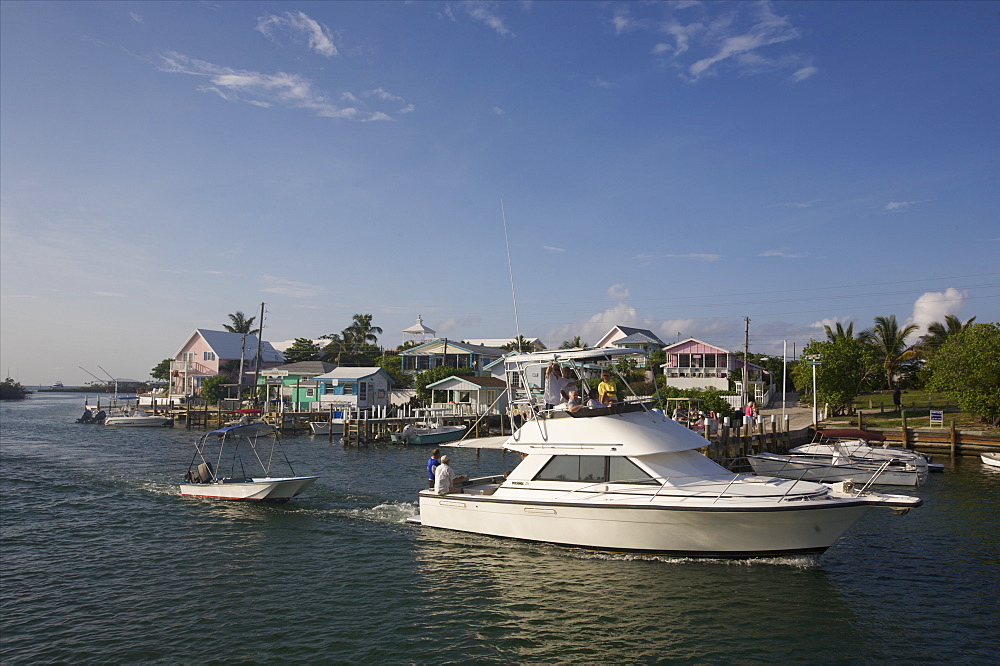 A fishing boat entering Marsh Harbour Bay on Great Abaco Island, Bahamas, West Indies, Caribbean, Central America