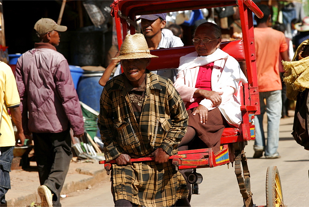 A pousse-pousse in the street in Antsirabe, a town renowned for the number of rickshaws, Madagascar, Africa