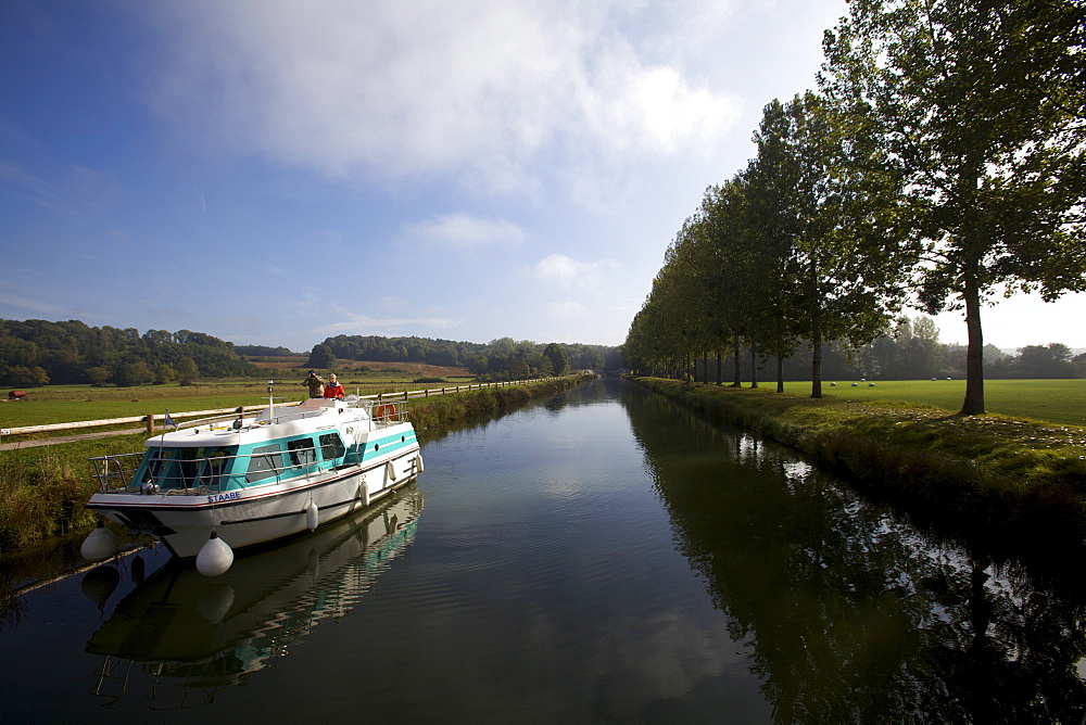 Navigation at dawn on the Saone river in Franche-Comte, France, Europe