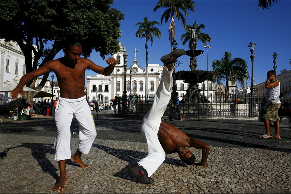 Some capoeira fighters on the 16 de novembro Square District of Pelourinho, Salvador de Bahia, Brazil, South America