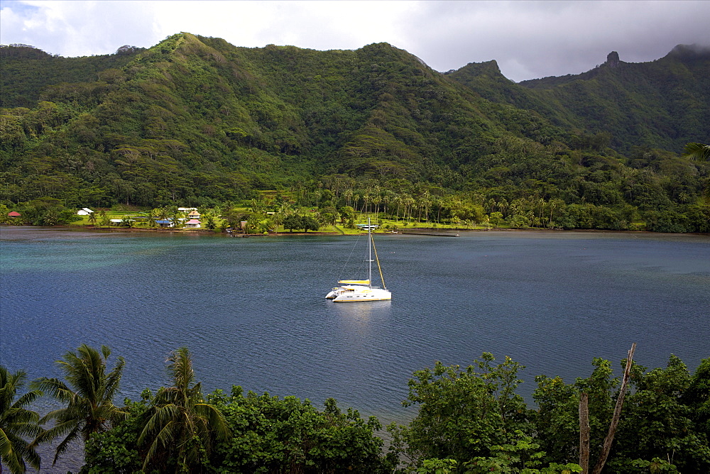 A cruise catamaran in the bay of Hamanee in Tahaa, French Polynesia, Pacific Islands, Pacific