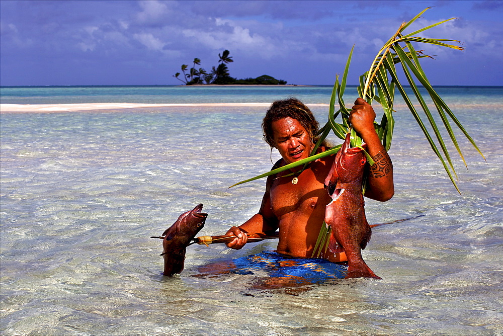 Fishing the traditional way with a harpoon, at the White Sands, Tetamanu Pass, Fakarava Island, Tuamotu archipelago, French Polynesia, Pacific