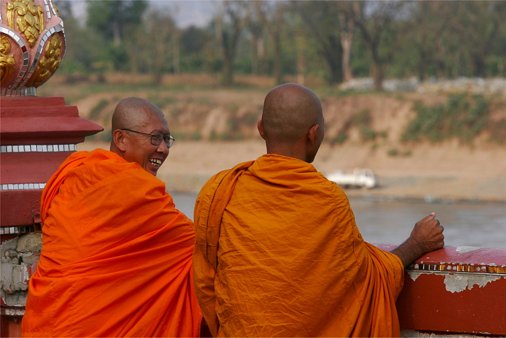 Two monks in the Sop Ruak temple, in front of the Mekong River, Thailand, Southeast Asia, Asia