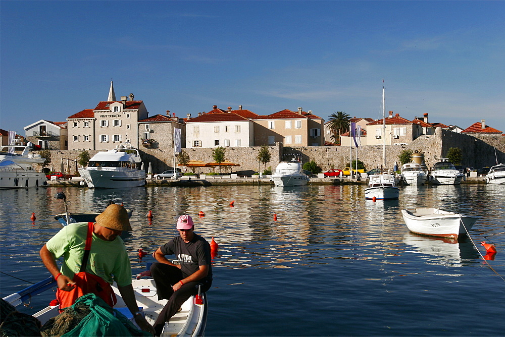 Fishermen in front of the small city of Budva, Montenegro, Europe