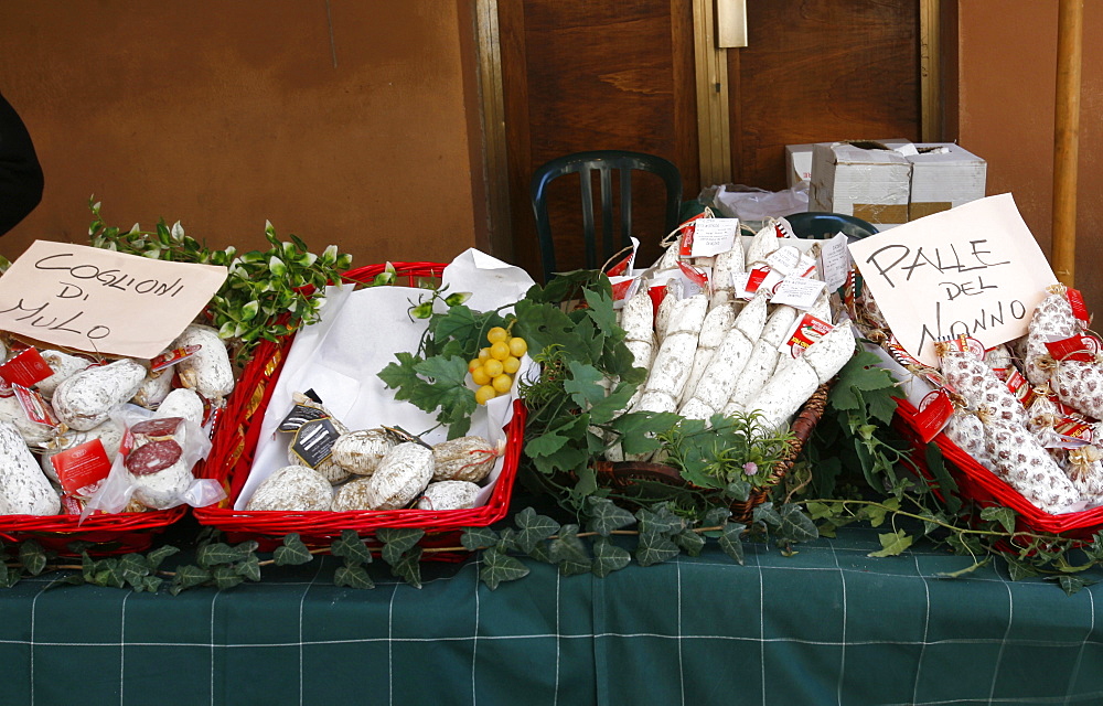 The front of a typical grocery shop, selling the famous coglioni di mulo (bollocks of donkey), a gastronomic speciality of Perugia, Umbria, Italy, Europe