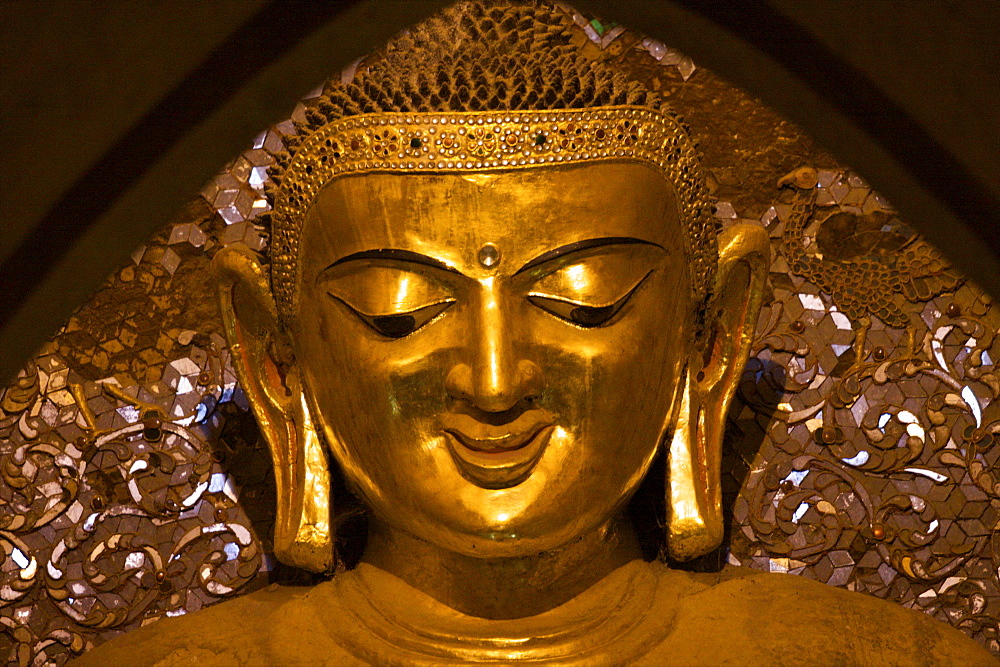 Detail of the Buddha statue iInside the Ananda temple in Bagan, Myanmar (Burma), Asia