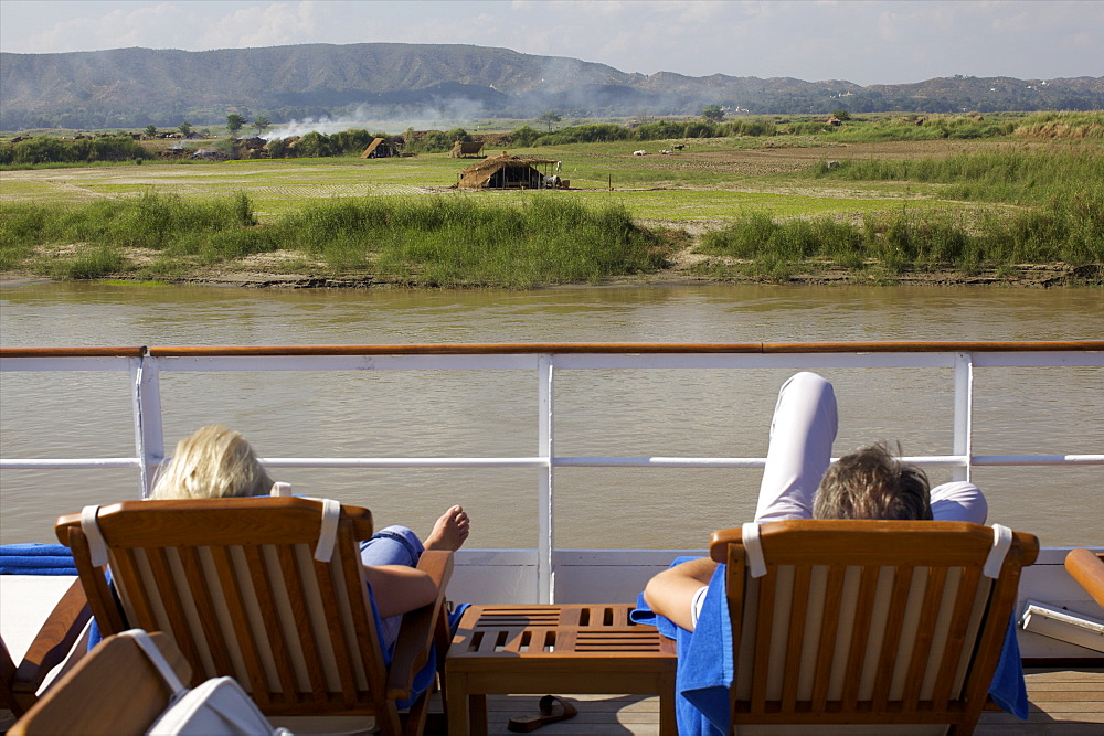 View of the shore of the Irrawaddy River, from the upper deck of the Road to Mandalay cruise boat, Myanmar (Burma), Asia