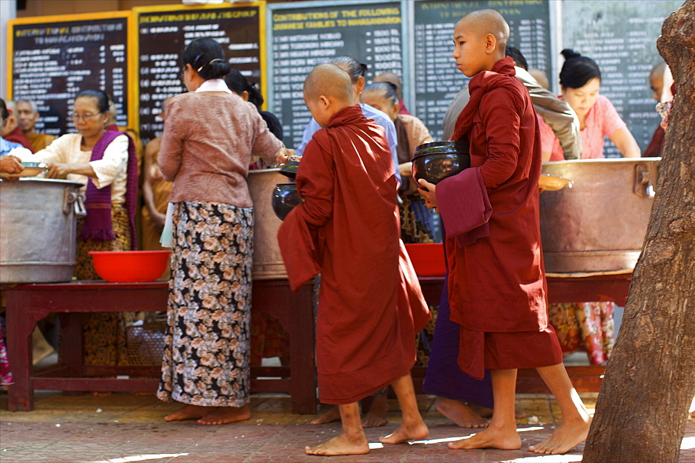 In the Amarapura monastery, close to U Bein bridge, monks collecting lunch, Myanmar (Burma), Asia